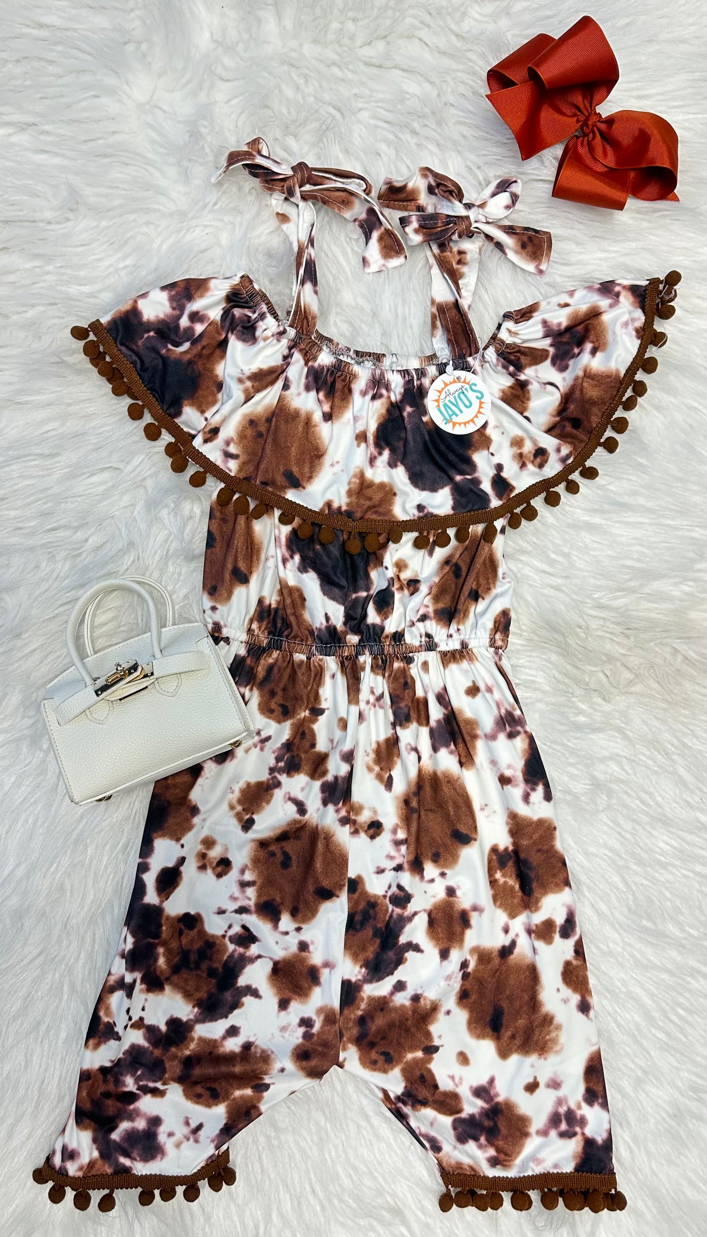 Cowhide Romper With Pom Poms